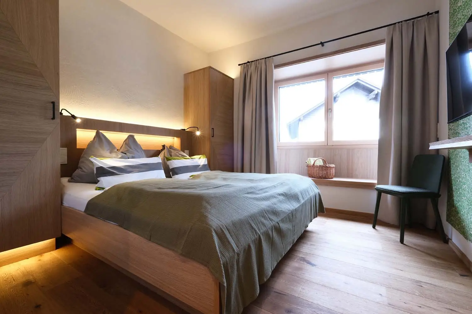 Das Schlafzimmer vom Doppelzimmer "Gemütlich" im Seehotel Kärntnerhof.