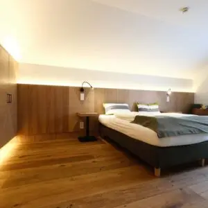 Schlafzimmer der Ferienwohnung Traumblick im Seehotel Kärntnerhof am Weissensee.